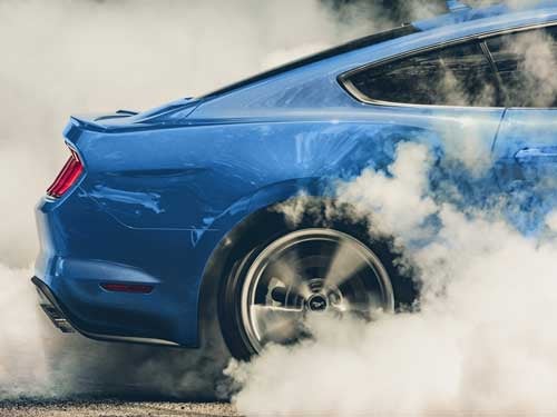 2023 Ford Mustang close up view of a burnout