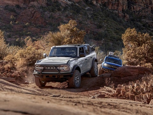 2024 Ford Bronco driving along a rocky path