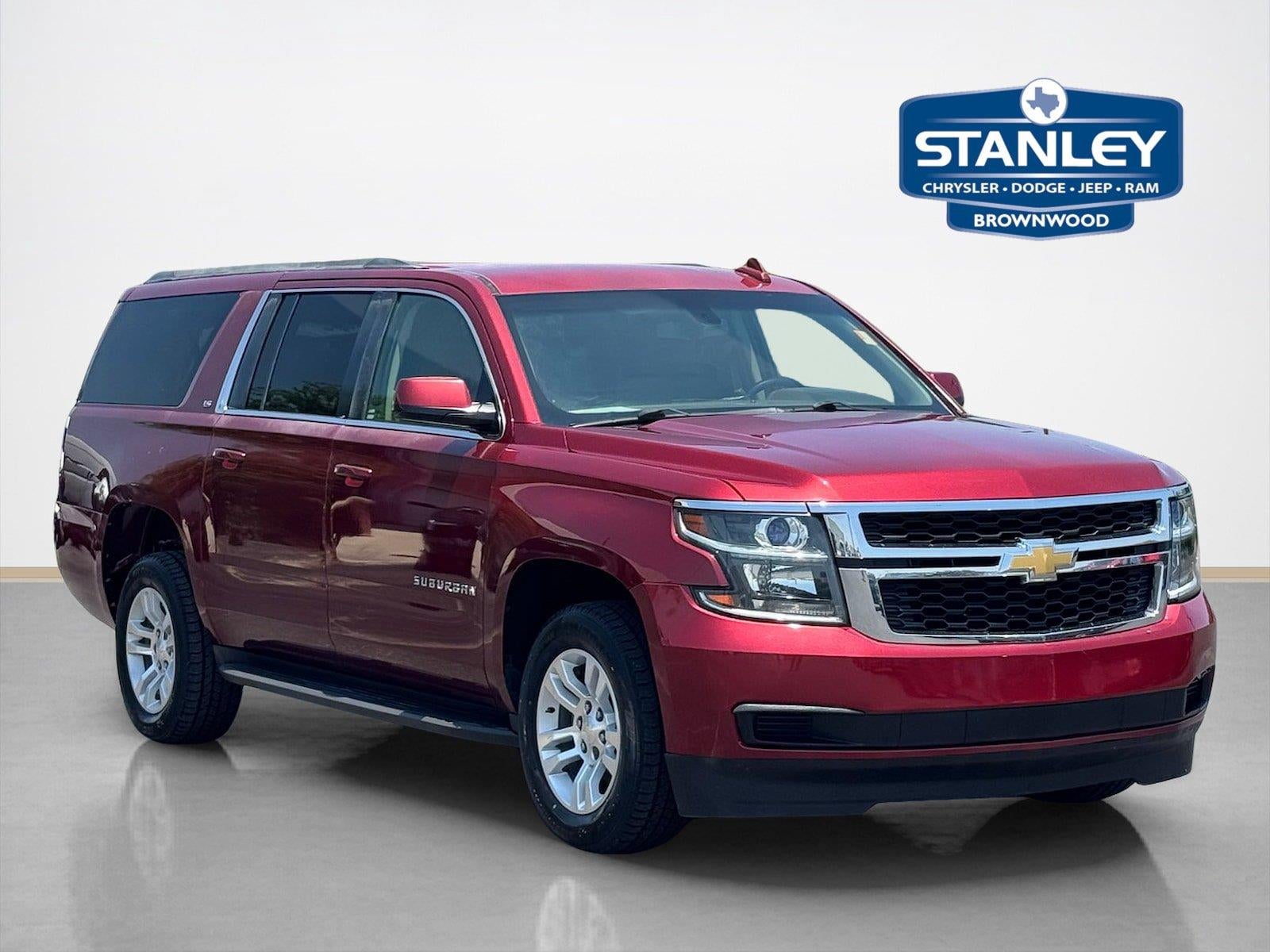2016 Chevrolet Suburban LS in Siren Red Tintcoat — front three-quarter view