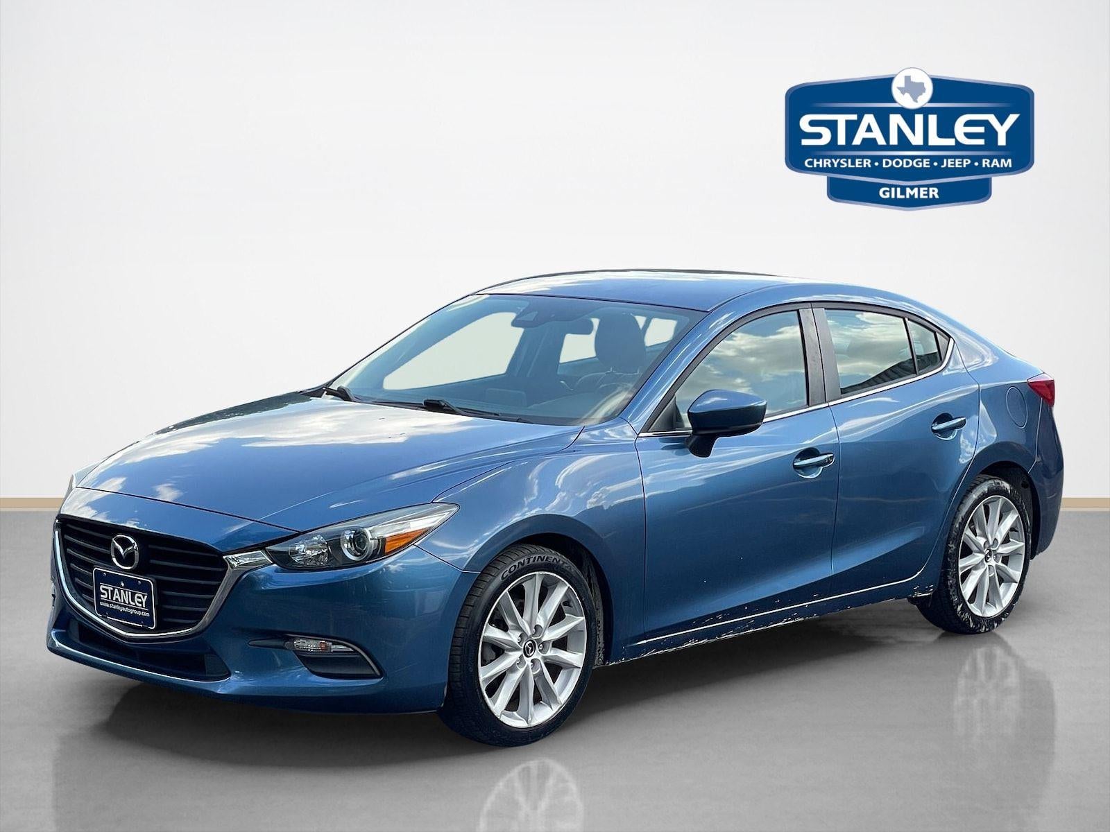 2017 Mazda Mazda3 4-Door Touring in Eternal Blue Mica — front three-quarter view