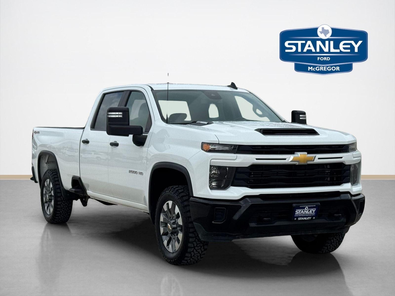 2024 Chevrolet Silverado 2500HD Custom in Summit White — front three-quarter view