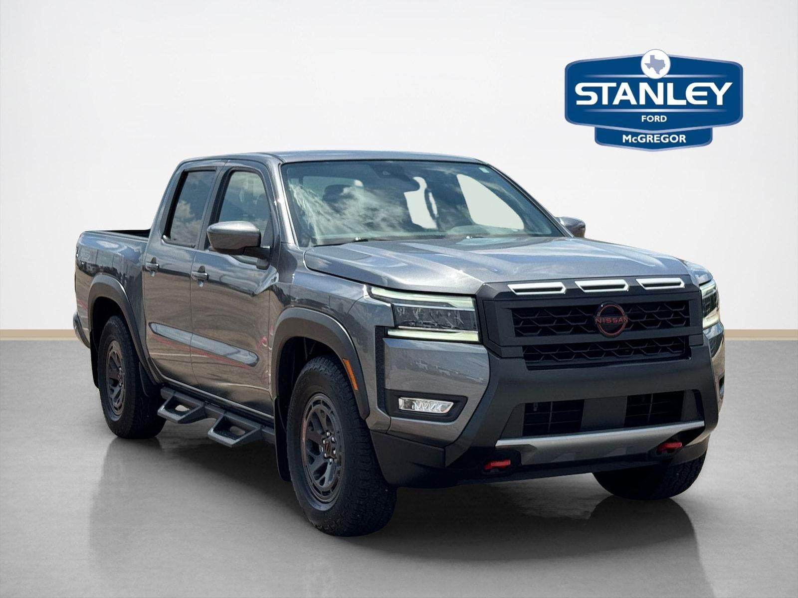 2025 Nissan Frontier PRO-X in Boulder Gray Pearl — front three-quarter view