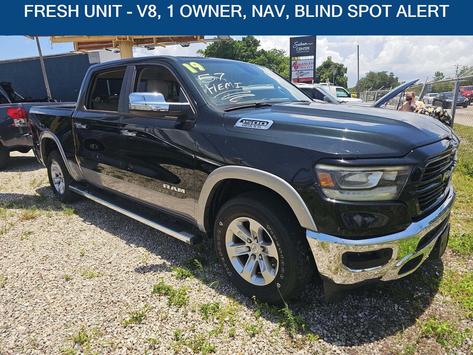 2019 RAM 1500 Laramie in Black Forest Green Pearlcoat — front three-quarter view
