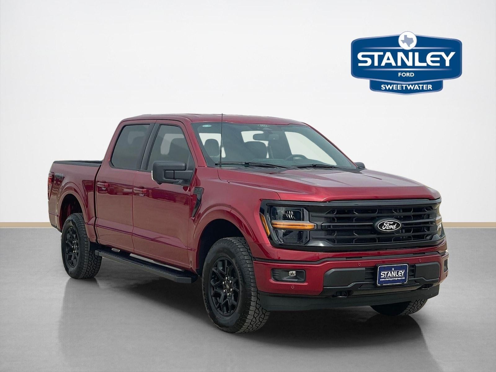 2026 Ford F-150 XLT in Ruby Red Metallic Tinted Clearcoat — front three-quarter view