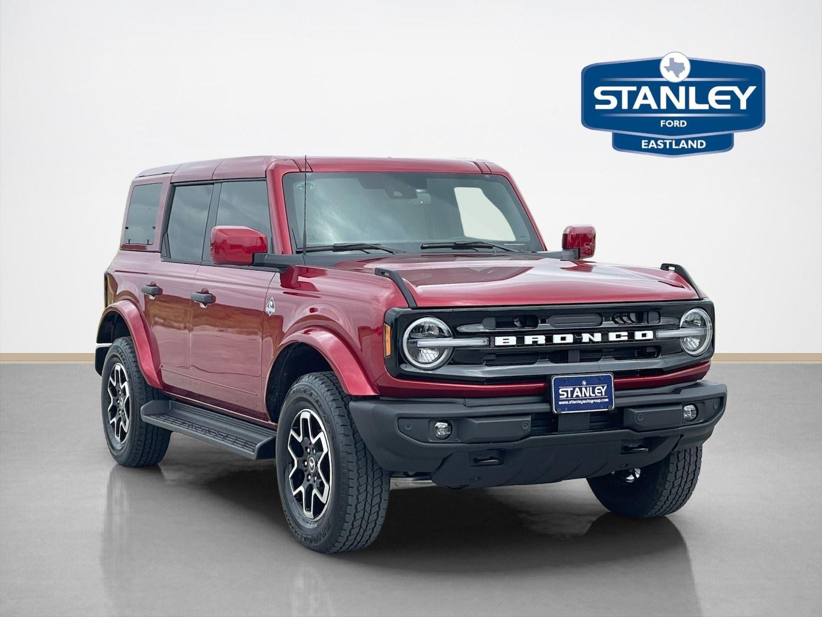 2026 Ford Bronco Outer Banks in Ruby Red Metallic Tinted Clearcoat — front three-quarter view