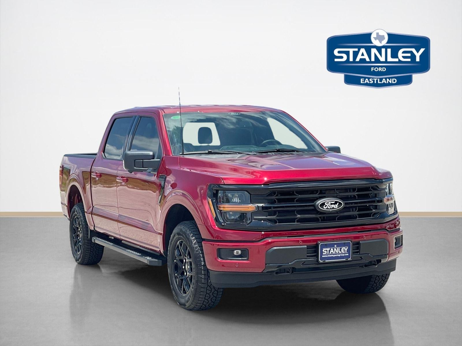 2026 Ford F-150 XLT in Ruby Red Metallic Tinted Clearcoat — front three-quarter view